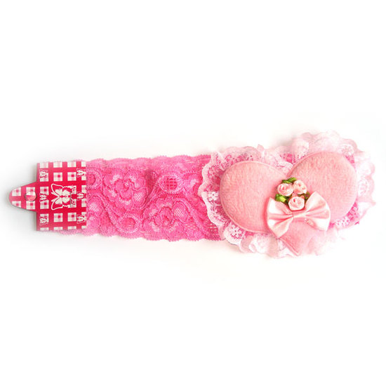 Rosa Masche und Blume auf rosa Spitzenhaarband